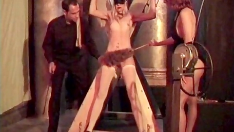 Sexy Blonde Is Bound In Red And Has Clamps Applied By Sadist